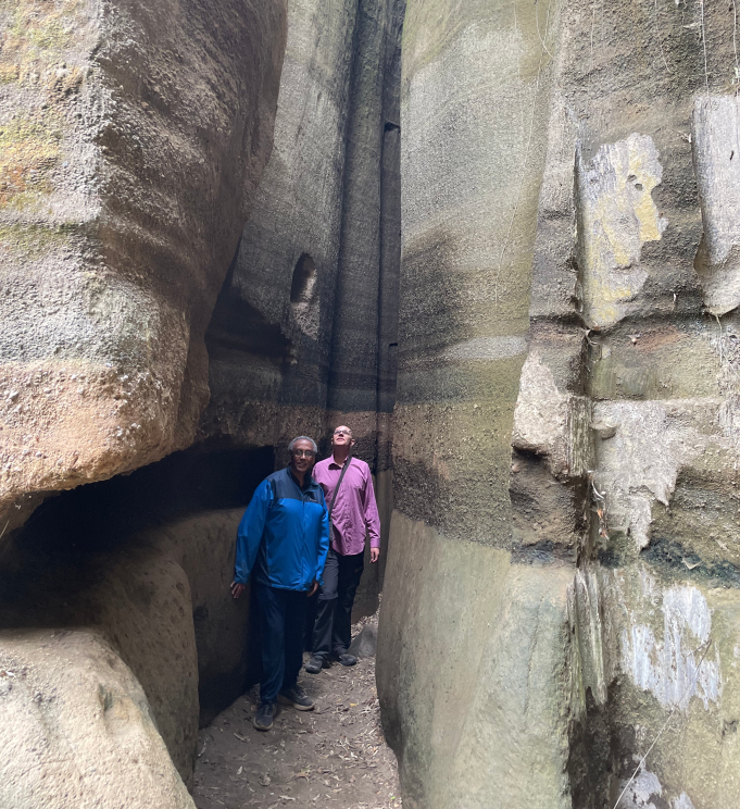 Participants exploring a rock formation in Nakuru Naivasha