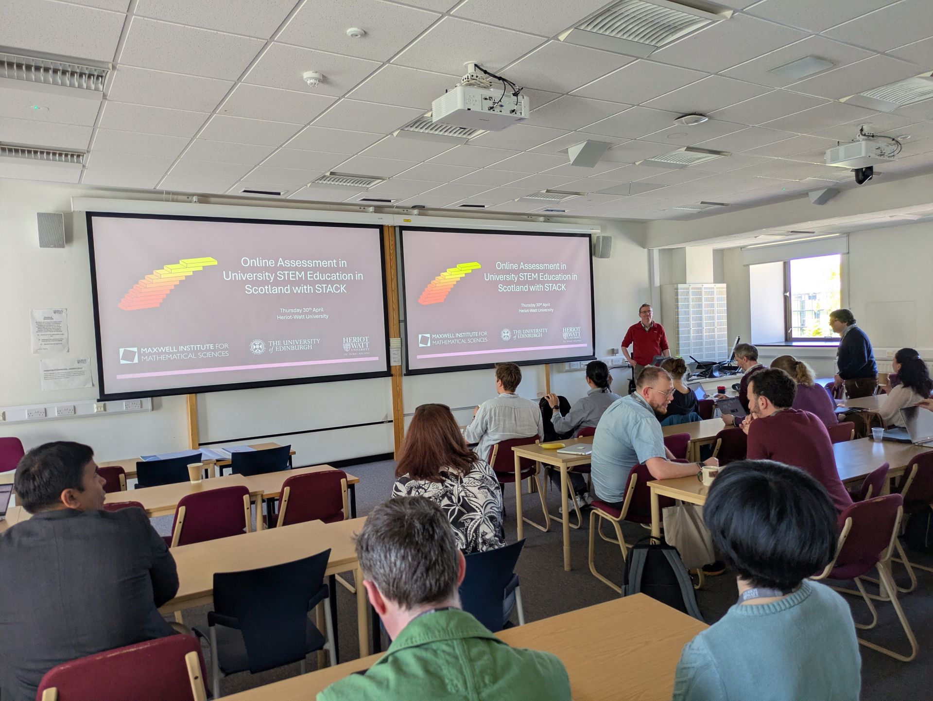 A photograph of Chris Sangwin giving a talk